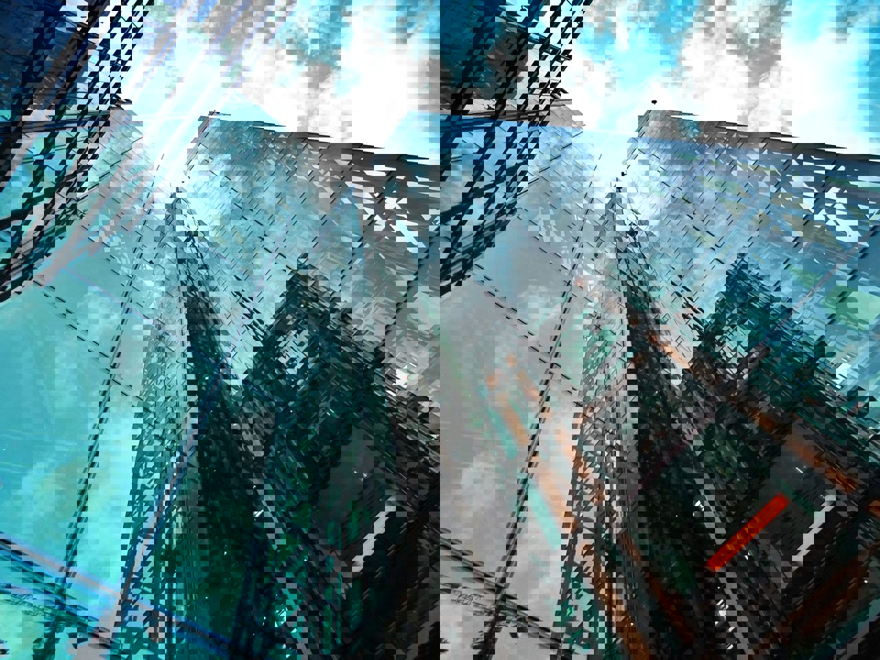 Office building reflecting other skyscraper