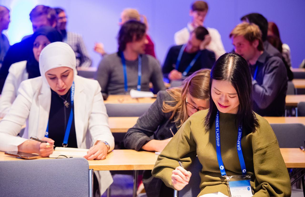 Three women reading at the Graphene Week 2019